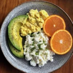 Avocado, Scrambled Eggs & Cottage Cheese Plate with Fresh Orange